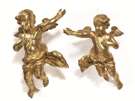 COPPIA DI PUTTI ALATI, FINE SECOLO XIXin legno intagliato e dorato, alt. cm...
