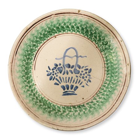 Piatto di Caltagirone spugnato verde  con al centro cesto di fior, 19° / 20° secolo