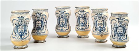 Sei albarelli in maiolica bianca con stemma, XVIII secolo altezza cm 24 (uno...