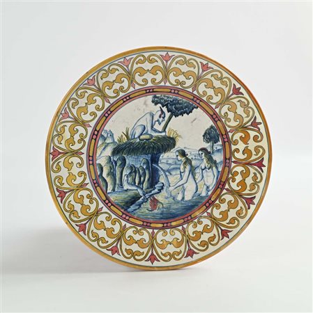 Piatto in maiolica bianca e blu e a lustro, XX secolo diametro cm 28,5 al...