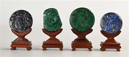 Quattro dischi in pietra dura, Cina, XX secolo altezza complessiva cm 10 ca....