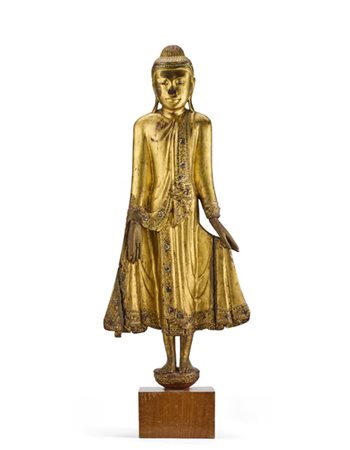 Scultura di Buddha stante in legno dorato con applicazioni in pasta vitrea, su