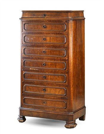 Settimanale in noce con fronte a sette cassetti bordati da cornicette mistiline