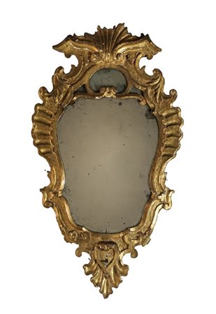 Ventola con cornice in legno intagliato e dorato di forma sagomata. Secolo XVII