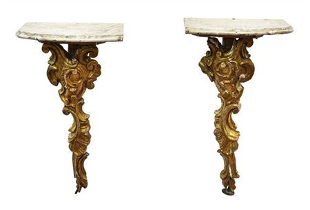 Lotto composto da due fregi dorati del secolo XIX in legno montati a console (h