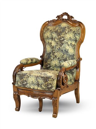 Poltrona reclinabile in noce intagliato con cimasa traforata a motivo rocaille,