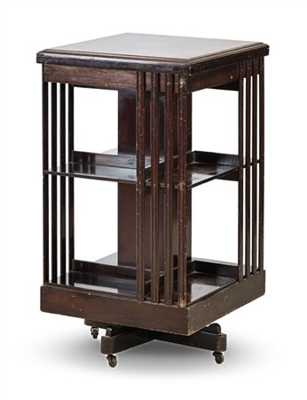 Libreria girevole in mogano con piano filettato in legni vari. Inghilterra, sec