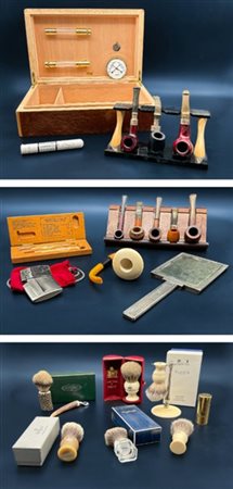 Cartone contenente numerose pipe, attrezzi per rasatura in custodie e accendini