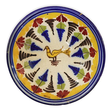 Piatto in ceramica di Talavera/Manises dipinto policromo con uccello giallo dipinto sul fronte