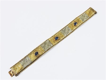 BRACCIALE IN ORO GIALLO, ORO BIANCO E VETRI BLU realizzato a piastre incise...