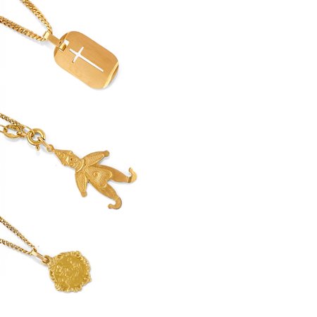 Tre collane con pendenti in oro giallo 18k