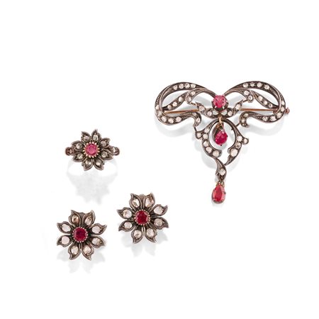 Parure con rubini in oro giallo 18k e argento