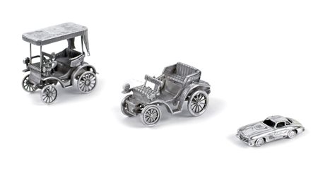 TRE MODELLINI DI AUTOMOBILI IN ARGENTO XX Sec. fogge e misure diverse peso...