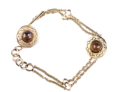 BRACCIALE A MAGLIE IN ORO GIALLO 18KT firmato Chimento con due quarzi fumè...