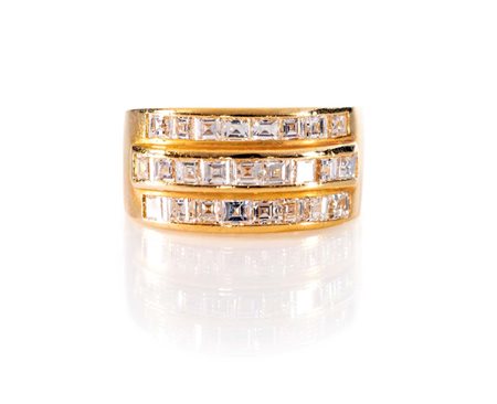 Anello a fascia in oro e diamanti in taglio carrè Oro giallo 750/000....