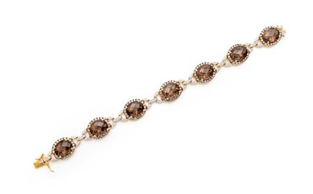 Bracciale in oro, brillanti, brillanti fancy e quarzi Oro giallo e bianco...