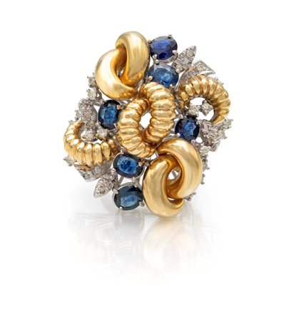 Anello a fiore in oro, brillanti e zaffiri Oro bianco e giallo 750/000....