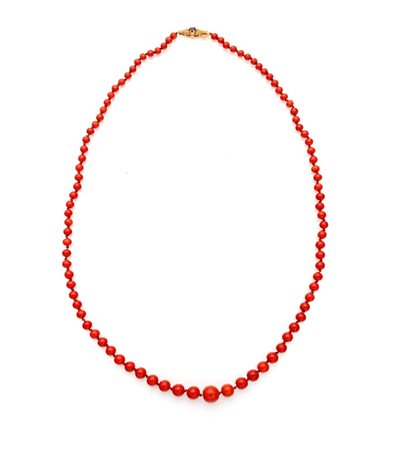 Collana in corallo e oro Oro giallo 750/000. Corallo rosso in taglio sferico...
