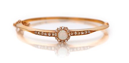 Bracciale rigido in oro, diamanti ed opale Oro giallo 750/000. Peso...