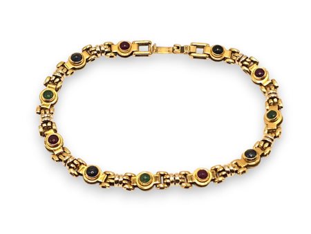  
Bracciale in oro con rubini, zaffiri e smeraldi    
 