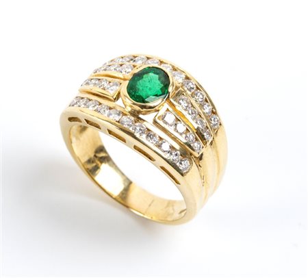  
Anello a fascia in oro con smeraldo e diamanti         
 