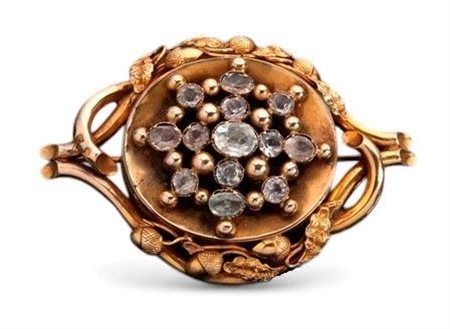  
Spilla vittoriana inglese in oro, cristallo di rocca e paste vitree fine XIX secolo
 
