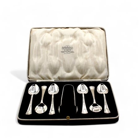 Astuccio con sei cucchiaini da te ed una pinza da zollette in metallo...