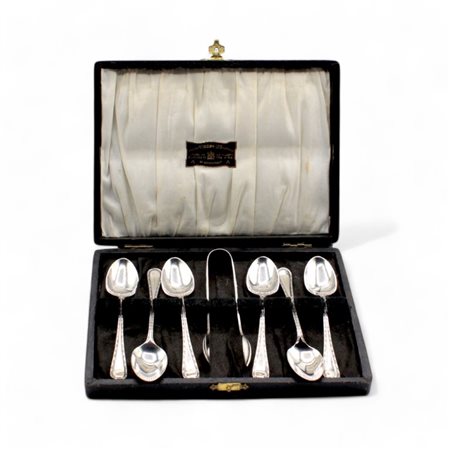 Astuccio con sei cucchiaini da te ed una pinza da zollette in metallo...