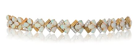 BRACCIALE BRACCIALE ANNI '70 CA. In oro giallo e bianco 18 kt con maglie a...