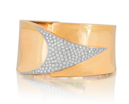 BRACCIALE BRACCIALE. In oro giallo e bianco 18 kt a schiava con apertura a...