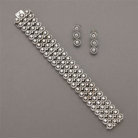 Demi-parure di finissima lavorazione: bracciale ed orecchini con maglia...