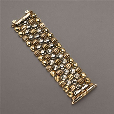 Bracciale in oro bianco, giallo e rosso con moduli bombati sfaccettati e...
