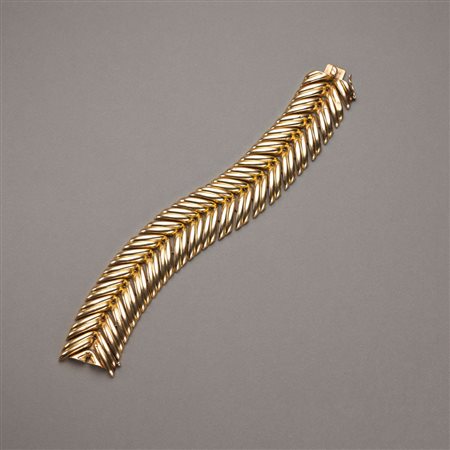 Bracciale in oro giallo bombato a spiga con scanalatura centrale, g.73,20,...