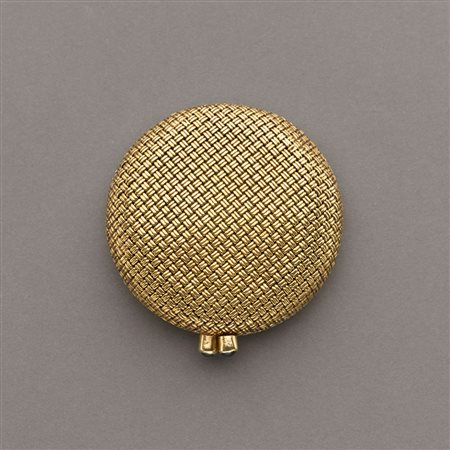 Portacipria rotondo in oro intrecciato con chiusura rifinita con zaffiri...