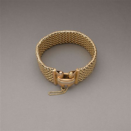 Bracciale morbido a maglia intrecciata in oro giallo con chiusura in oro...