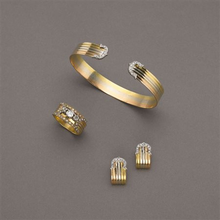 Parure in oro bianco, giallo e rosso con bracciale alla schiava, orecchini ed...