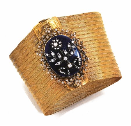 BRACCIALE IN ORO GIALLO, ARGENTO, DIAMANTI E SMALTOrealizzato a nastro...