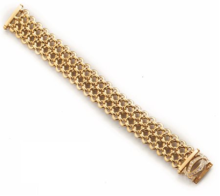 BRACCIALE, CARTIER, IN ORO GIALLO E DIAMANTIrealizzato a tre file di maglie...