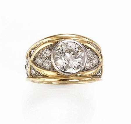 ANELLO IN ORO GIALLO, ORO BIANCO E DIAMANTI realizzato a fascia in oro...