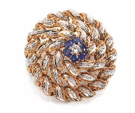 SPILLA IN ORO GIALLO, ORO BIANCO, ZAFFIRI E DIAMANTIdi forma circolare con...