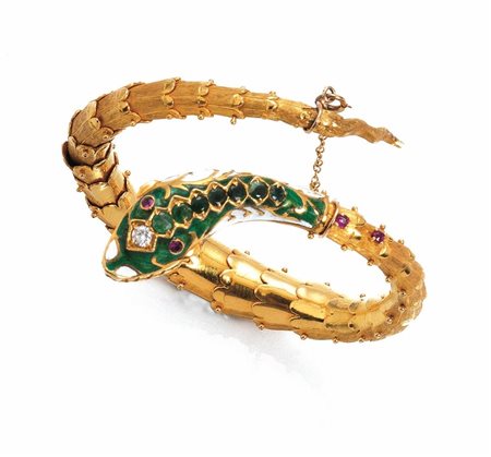 BRACCIALE IN ORO GIALLO, RUBINI, SMERALDI, DIAMANTE E SMALTIdi forma a...