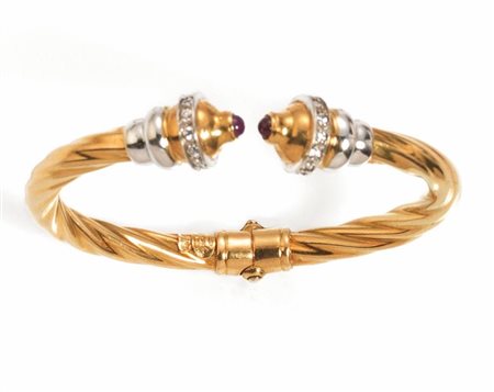BRACCIALE IN ORO GIALLO, ORO BIANCO, RUBINI E DIAMANTIa cerchio ridigo...