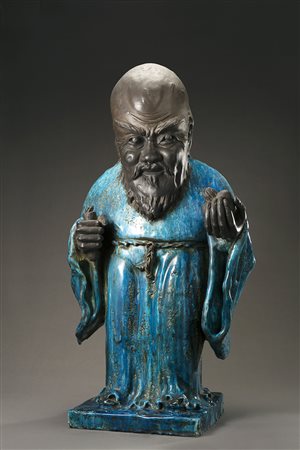 Figura del saggio Shoulao in ceramica turchese e nera, con frutto nella mano...