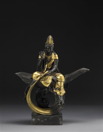 Bodhisattva Avalokitesvara in bronzo raffigurato seduto con una gamba...