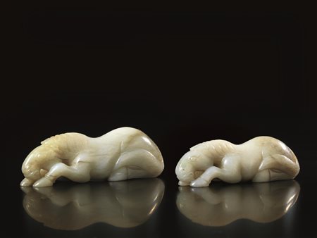 DUE INTAGLI, CINA, SECC. XIX-XX in giada celadon, modellati nella forma di...