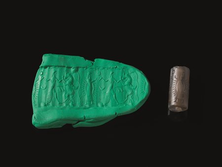 SIGILLO A CILINDRO Materia e tecnica: calcedonio grigio inciso e levigato...