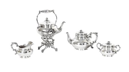 SERVITO DA TE IN METALLO ARGENTATO Milano, Broggi coperchi con presa a foggia...