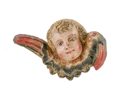 SCULTURA in legno policromo raffigurante "testa di putto alato". Italia XVIII...