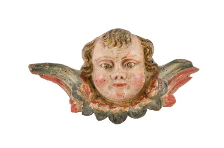 SCULTURA in legno policromo raffigurante "testa di putto alato". Italia XVIII...
