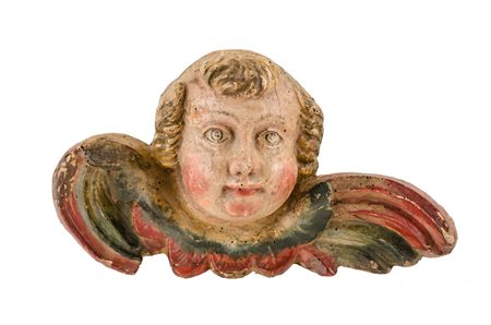 SCULTURA in legno policromo raffigurante "testa di putto alato". Italia XVIII...